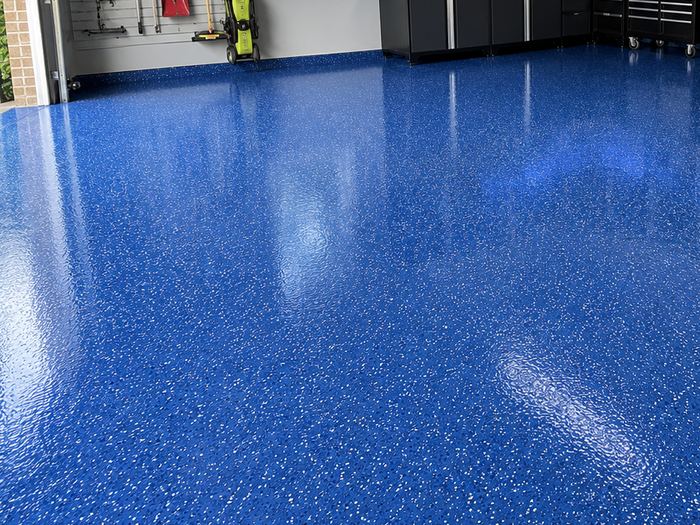 Close view of a blue speckled epoxy floor finish