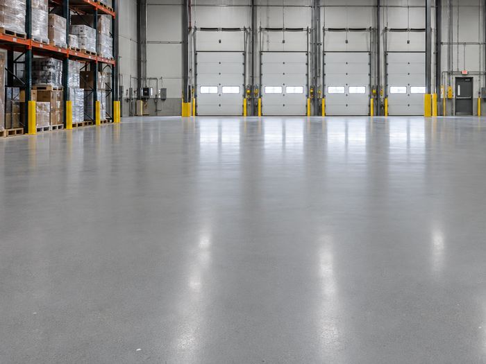 Warehouse floor with a glossy grey industrial coating