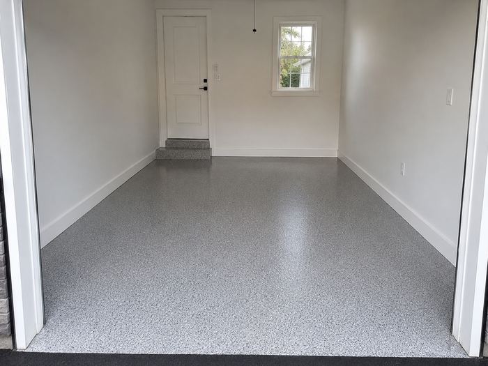 Smooth resurfaced and coated garage floor